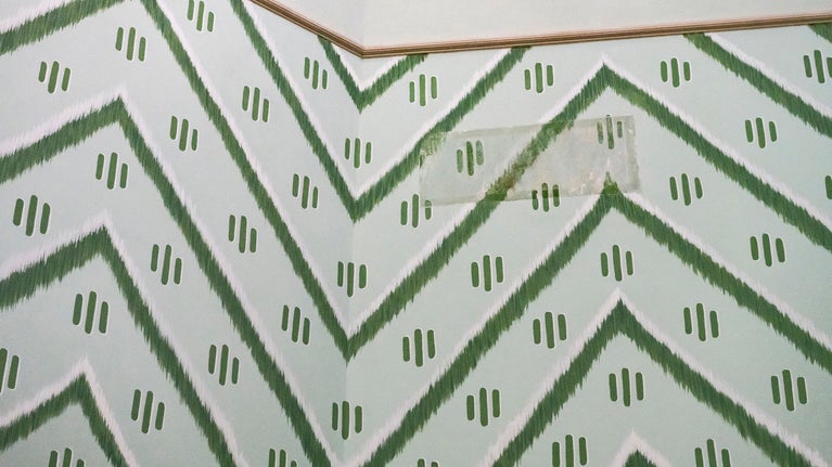 Wall pattern in the Octagon room at A la Ronde, Devon, with patch of original painting in centre.